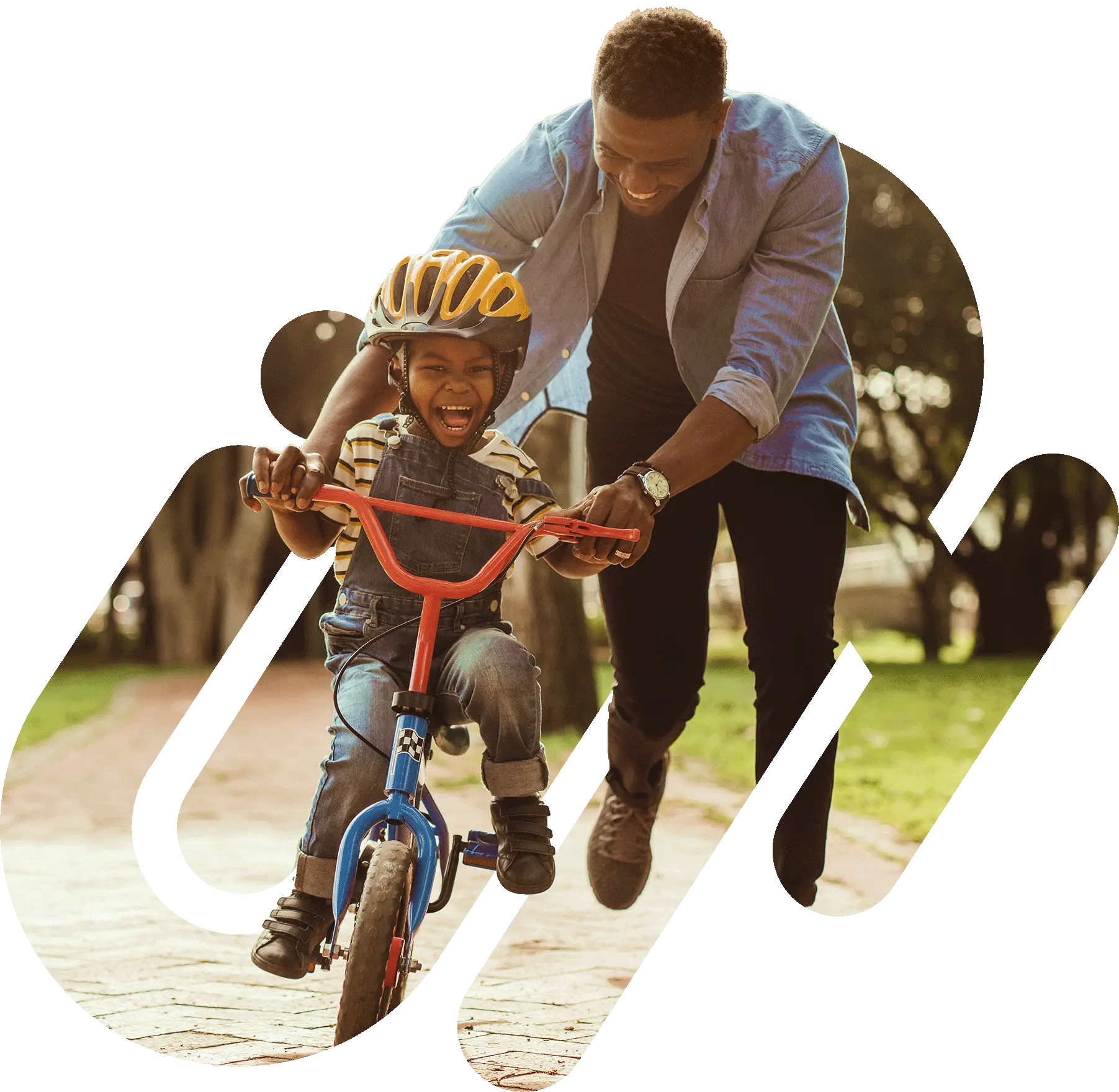 Father teaching his son to ride a bicycle