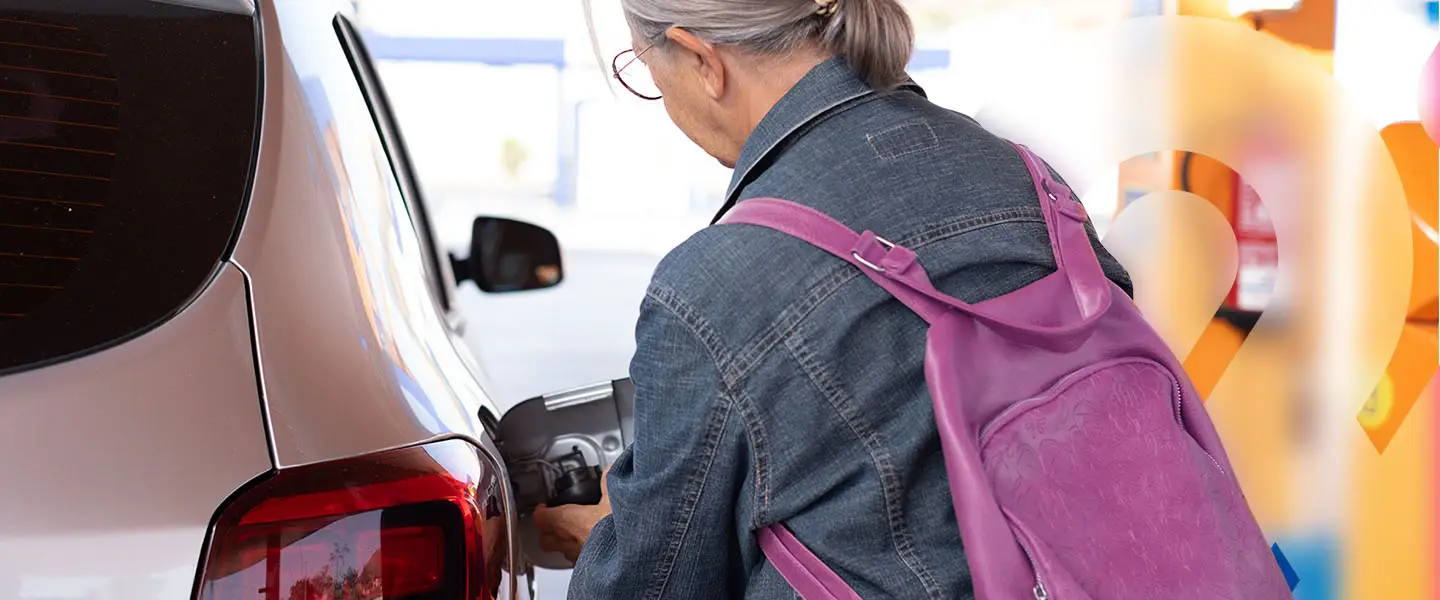 Lady putting petrol in car