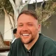 Close up of Matt Oliver in a shirt smiling